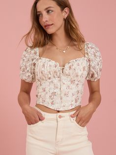 This top features puff sleeves with a lace fabrication. The corset-inspired bodice cinches your waist for a flattering silhouette, ensuring you turn heads wherever you go. Floral Corset Top, Corset Tops, Floral Corset, Lace Up Top, Chenille Sweater, Altar'd State, Girly Fashion, Romper With Skirt, Shop Maxi Dresses