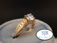 "💎Diamond💍Engagement Ring💎 Built in all 14k yellow gold, Featuring a beautiful vintage inspired design. Set with .33cts total weight of sparkling Genuine White Diamonds channel set down each side, with a center CZ place holder, ready to set your special Diamond or Gemstone (we can supply something special for you, please contact us for center stone pricing). This beautiful Vintage Design Engagement Ring 💍 is in stock and ready to ship. Also available in Rose Gold or White Gold by special ord Heirloom Yellow Gold Wedding Ring With Center Stone, Heirloom Solitaire Yellow Gold Wedding Ring, Heirloom Yellow Gold Solitaire Wedding Ring, Classic Gold Filigree Ring With Brilliant Cut, Classic Gold Wedding Ring With Diamond Accents, Gold Wedding Ring With Center Stone, Gold Art Deco Engraved Wedding Ring, Anniversary Filigree Ring In Yellow Gold With Diamond Accents, Classic Yellow Gold Engraved Ring With Center Stone