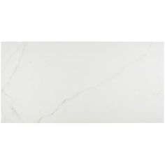 a white marble tile wall that looks like it is being used as a counter top