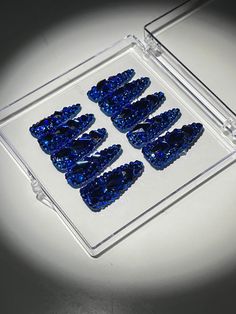 Royal Blue Crystal Stilleto Handmade Press On Nails—flashy and fabulous without the hassle! Put on your party nails in a flash and dazzle any room you enter. These press-ons will have everyone asking, "Who does your nails?" (our little secret).    Includes 10 nails, file & nail glue    Shape: Stilleto    Length: Extra Long Blue Fingernails, Nails File, Nails Necklace, Party Nails, Jumpsuits And Romper, Crystal Design, Dramatic Look, Club Style, Nail Glue