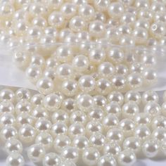 white pearls are shown in this close up photo