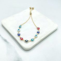 "18k Gold Filled 1mm Box Chain with Colored Colorful Enamel Evil Eyes Charms Linked Adjustable Bracelet, Wholesale Jewelry Making Supplies Bracelet Size: -Length: 3.0 inches / Width: 6mm 💎 With new products daily, quality and competitive prices, in DiJu Jewelry you find the most unique styles of modern designs, always looking for elegance and market trends. *Helping your Jewelry Businesses Grow *Starting your Own Business *Making your Own Collection: DiJu Jewelry ever brings Better Moments for Multicolor Evil Eye Jewelry, Adjustable Multicolor Nickel-free Jewelry, Adjustable Multicolor Chain Bracelet, Multicolor Round Evil Eye Jewelry, Multicolor Metal Jewelry As A Gift, Dainty Multicolor Bracelets With Adjustable Chain, Multicolor Metal Jewelry As Gift, Multicolor Metal Jewelry For Gifts, Multicolor Round Gold Plated Jewelry