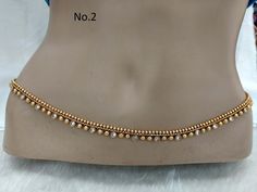 * Beautifully designed gold color belly chain. * can be used with belly dance costumes and saris. * Adjustable from 26 to 41 inches waist. Traditional Gold Bridal Belt With Tilla, Elegant Gold Chain Belt For Festival, Elegant Gold Bridal Belt With Tilla Detailing, Elegant Gold Bridal Belt With Tilla, Traditional Gold Bridal Belt For Festivals, Festive Gold Bridal Belt With Tilla Detailing, Festive Waist Chain With Latkans For Festivals, Traditional Waist Chain With Latkans For Festivals, Traditional Waist Chain With Latkans For Wedding