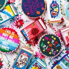 many different types of embroidered badges on a table