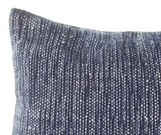 a blue and white striped pillow on a white background