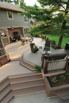 an outdoor deck with steps leading up to the patio