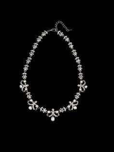 Victorian style crystal rhinestone and pearl charm necklace. Curb chain with lobster claw closure. The filigree is plated in rhodium. Measurement is a total length of 18.0 inches. Handmade in USA. Formal Silver Rhinestone Pearl Necklace, Formal Silver Rhinestone Necklace With Pearls, Formal Silver Pearl Rhinestone Necklace, Silver Pearl Rhinestone Necklace For Formal Occasions, Silver Rhinestone Necklace With Pearl Chain, Elegant Silver Rhinestone And Pearl Necklace, Silver Crystal Pearl Necklace With Rhinestones, Silver Bridal Necklace With Pearl Chain And Crystal, Silver Pearl Necklaces With Sparkling Stones