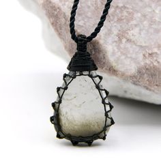 Beautiful handmade macrame-wrapped Tourmalated Quartz pendant, with an adjustable black necklace cord. Tourmalated Quartz is known as a powerful crystal that combines and amplifies the properties of Tourmaline and Clear Quartz Crystal. It is believed to offer physical protection acts as a negativity shield, and brings to the wearer's life luck, grounding, and balancing energy. This necklace can be a perfect meaningful gift for your loved one or yourself! ►►This is a one-of-a-kind necklace, you w Spiritual Black Crystal Necklace With Adjustable Cord, Black Crystal Necklace With Adjustable Cord, Hand Wrapped Black Jewelry With Waxed Cord, Black Pendant Necklace With Waxed Cord, Black Pendant Necklace On Waxed Cord, Black Jewelry With Adjustable Cord For Healing, Black Pendant Jewelry With Waxed Cord, Black Waxed Cord Pendant Jewelry, Macrame Crystal Necklace