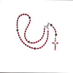 Handmade Catholic Rosary -Small, light Siam (red) glass beads, swirled red beads with blue and yellowish gold swirls.AVE (Hail Mary Beads): 6 mm, Czech light Siam red fire polished glass beadsPATER (Our Father Beads): 8 mm, red swirl glass beadsCROSS: Approx. 2", red enamel inlay, silver tone metal St. Benedict crucifixCENTERPIECE: Miraculous Mary LENGTH: 17 inches Also known as Dominican Rosary and Holy Rosary. The St. Benedict medal serves as protection against evil and temptation, secures a t Red Coral Jewelry With 8mm Beads, Spiritual Red Jewelry For Christmas, Handmade Red Beads For Christmas, Red Czech Glass Spiritual Jewelry, Red Heart Beads For Jewelry Making, Red Heart Beads For Gifts, Handmade Red Christmas Beads, Red Czech Glass Jewelry With Spacer Beads, Red Spacer Beads For Jewelry Making