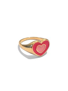 A gold finished ring with a bright pink 70s heart in the middle. The ring is around a size 7, but we encourage you to wear this as a ring for any finger- it looks great as a midi ring too! Pairs beautifully with our Groovy Nailz 100% Zinc Alloy. Keep away from moisture to prevent fading. Trendy Pink Jewelry For Anniversary, Pink Open Ring Jewelry For Valentine's Day, Gold Heart-shaped Enamel Ring For Anniversary, Trendy Pink Heart Promise Ring, Trendy Pink Enamel Ring As Gift, Trendy Pink Enamel Ring For Gift, Trendy Pink Heart-shaped Rings, Trendy Heart-shaped Rings For Valentine's Day, Cute Gold Rings For Valentine's Day