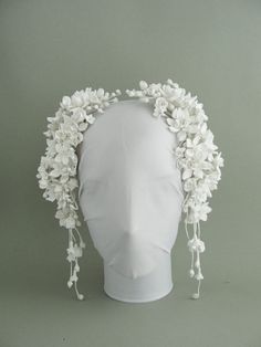 a white headpiece with flowers on it