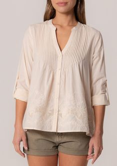 A cotton long sleeve bohemian spring blouse with embroidered detail. Cotton Embroidered Relaxed fit Long rolled sleeve with button tab closure Hip length V-neckline Self-covered button front Pintuck details Lined Bohemian spring blouse An elevated take on a classic style. Our cotton long-sleeve blouse features delicate pintuck details, a self-covered button front, and a flattering v-neckline. The embroidered detail adds a bohemian touch. Model is 5'9, wearing a size S.Style: I-15088W-SGI Pintuck Blouse, Spring Blouse, Pick Stitch, Spring Blouses, Cute Spring, Pin Tucks, Embroidered Blouse, Online Sales, Boho Tops