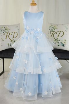 Modsele light blue flower girl dress features with rounded neckline, handmade flowers, and multi-tiered skirt.#flowergirldresses#girlpartydresses#girlbirthdaydresses Light Blue Tulle Dress With Floral Applique, Spring Wedding Princess Dress With Tiered Shape, Sleeveless Ruffled First Communion Dress For Pageant, Sleeveless First Communion Dress With Ruffles For Pageant, Sleeveless Ruffled First Communion Dress For Pageants, Blue Sleeveless Tulle Tutu Dress, Light Blue Princess Sleeveless Tutu Dress, Light Blue Sleeveless Princess Tutu Dress, Sleeveless Ruffled Tutu Dress For First Communion