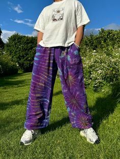 Elevate Your Festival Wardrobe with These Stunning Unisex Tie-Dye Hippie Trousers! Designed for ultimate comfort and style, these unisex Hippie Trousers are the perfect addition to your festival wardrobe and everyday look. Crafted from sustainable, eco-friendly cotton, these trousers are ideal for those who value both fashion and the environment. Whether you're dancing at a festival, flowing through yoga, or simply embracing your free-spirited lifestyle, these trousers will keep you feeling and Hippie Cotton Bottoms For Meditation, Bohemian Harem Bottoms With Relaxed Fit, Bohemian Relaxed Fit Harem Pants For Festival, Bohemian Relaxed Fit Yoga Pants, Bohemian Relaxed Fit Harem Pants, Bohemian Style Relaxed Fit Bottoms, Hippie Cotton Harem Pants For Meditation, Cotton Hippie Harem Pants For Meditation, Hippie Style Yoga Pants With Relaxed Fit