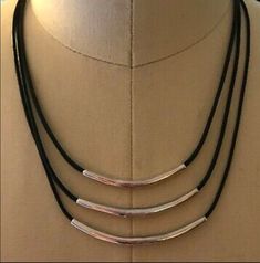 "Silpada 3 layered black leather strands have a ever widening silver band accent to each., 16\" long with a 2\" extender and a lobster clasp. Excellent condition, former display item. Box not included." Adjustable Silver Multi-strand Choker, Tube Necklace, Tiered Necklace, Silver Bar, Silver Bars, Multi Strand, Silver Band, Matching Earrings, Vintage Necklace