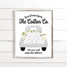 the cotton co sign hangs on a white wall