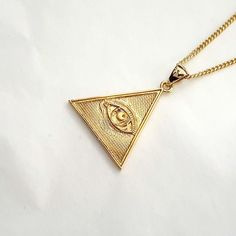 women's and men's triangle the Eye of Providence necklace pendant 2 made in 14k solid gold or 18k solid gold the eye of providence with exquisite details is on a triangle pendant. the Eye of Providence is a symbol that depicts an eye, meant to represent divine providence, whereby the eye of God watches over humanity. - this pendant height is 25.5mm without the bail. - model wears a 1.7mm 50cm chain. - materials: real 14k solid gold, real 18k solid gold - designed by carre d'or - made in South Korea 14k gold pendant necklace weight pendant only 3.94g (±3%) with a 1.4mm 42cm chain 6.80g (±3%) with a 1.7mm 42cm chain 8.02g (±3%) with a 2.1mm 42cm chain 9.90g (±3%) 18k gold pendant necklace weight pendant only 4.70g (±3%) with a 1.4mm 42cm chain 8.11g (±3%) with a 1.7mm 42cm chain 9.51g (±3%) 14k Gold Triangle Jewelry, 14k Gold Triangle Shaped Jewelry, Triangle Yellow Gold 14k Jewelry, 14k Gold Triangle Jewelry In Gold Color, The Eye Of Providence, Triangle Eye, Gold Necklace Pendant, Divine Providence, Eye Of Providence