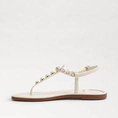 Our signature strap Gigi sandal with a vintage reinvention. Pearl embellishments bring classic elegance to this springtime staple. Details Gigi Pearl Thong Sandal Closure: Buckle Toe: Open Elegant Beach T-strap Sandals With Adjustable Strap, Classic Toe Post Sandals For Spring, Classic T-strap Sandals For Spring, Classic Beach T-strap Sandals For Spring, Classic T-strap Sandals For Beach And Spring, Elegant T-strap Sandals With Adjustable Single Toe Strap, Classic Spring Beach T-strap Sandals, Classic T-strap Sandals With Toe Post For Summer, Classic T-strap Toe Post Sandals For Summer