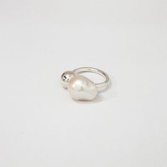 Designer Notes + Baroque pearl silver ball ring. Model is wearing size 6 ( US ring size ) . Details + •Color: Gold Vermeil - 18K Solid gold vermeil plated Sterling silver. Sterling Silver plated in rhodium. • Handcrafted by artisans in New York City. • Care: Keep airtight (concealed) to maintain color and shine. Refrain from touching or putting stress on the chains Pearl Ring Design, Chloe Ring, Ring Model, Phone Items, Contemporary Jewelry, Silver Pearls, Women's Jewelry, Baroque Pearls, Pearl Ring