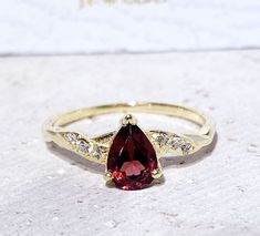 Don't miss this opportunity to own this beautiful gemstone ring crafted in 14k gold filled => Gemstone Type - Garnet, Clear quartz => Gemstone Size - 5*7 mm => Gemstone Cut - Faceted => Total Number of Gemstones - 7 => Metal Type - 14k Gold Filled (Tarnish Resistant And Nickel Free) - also available in 925 sterling silver * Please contact me for pricing on a sizes larger than 11 * ~ Feel free to ask me about custom made designs. ❏ Replacements and custom orders : ✪ 925 sterling silver - no addit Pear-shaped Gold Ring With Gemstone Accents, Fine Jewelry Red Teardrop Ruby Ring, Classic Red Teardrop Ring, Elegant Pear-shaped Red Rings, Elegant Red Pear-shaped Rings, Gold Teardrop Rings With Gemstone Accents, Gold Teardrop Ruby Ring As Gift, Gold Teardrop Ruby Ring Gift, Classic Teardrop Ruby Ring For Gift