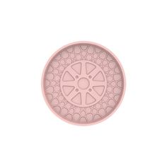 a pink plate with an intricate design on the front and center, set against a white background