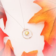 November Birthstone Necklace, November Yellow Topaz Jewelry, November Birthday Gift, November Birthstone Jewelry, Sterling Silver Necklace Lovely November Birthstone Yellow Topaz Necklace. People born in November have two birthstones - Topaz & Citrine. For many designs we use the topaz birthstone, a beautiful amber-colored gem. It symbolizes love and is said to bring strength and increased intellect to the wearer. 💛 A rustic, sterling silver twig ring (20mm in diameter), surrounds a beautif Amber Gemstone Necklace For Anniversary, Yellow Gemstone Necklace For Anniversary, Yellow Birthstone Round Pendant Necklace, Round Stone Birthstone Necklace For Birthday, Citrine Birthstone Jewelry With Round Stone, Citrine Birthstone Jewelry, Birthday Birthstone Necklace With Round Stone, Citrine Round Pendant Necklace For Anniversary, Topaz Birthstone Jewelry With Round Stone