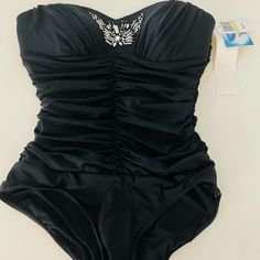 Brand New With Tags Black Beaded One Piece Swimsuit. Runs Small , Fits Like Xxs-Xs Elegant Black Bodysuit For Pool, Elegant One-piece Bodysuit For Evening, Elegant Evening One-piece Bodysuit, Elegant One-piece Bodysuit For Pool, Elegant Fitted Lined Swimwear, Elegant Embellished Fitted Bodysuit, Elegant Fitted Swimwear For Evening, Embellished Fitted Party Swimwear, Elegant Stretch Embellished Bodysuit