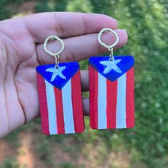 a pair of red, white and blue earrings with an american flag design on them