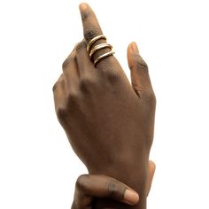 The Amali Open Ring stands out effortlessly with its subtle, soft curves. Perfect to wear solo or with your favorite ring stack. In Swahili, Amali means hope. Handcrafted by artisans in Kenya with 24k gold plated brass using traditional techniques. Maximum thickness: 0.11in (3mm) Minimum thickness: 0.07in (2mm) Height: 1in (25.4mm) Size Chart Open Ring Gold, Stackable Necklaces, Tarnish Remover, Stacked Earrings, Ring Stack, Ring Stand, Handcrafted Rings, Open Ring, Favorite Rings