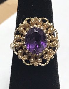 VINTAGE AMETHYST 14K YELLOW GOLD FILIGREE RING Beautifully crafted in 14k yellow gold, this 3CT Oval cut Amethyst Solitaire Ring is sure to please! This item is vintage and in excellent condition. It is sure to be one of your favorite pieces! Purple Vivid Hue 4.7 Grams Shipped insured/delivery confirmation I guarantee item to be exactly as described and pictured. Estate Style 14k Gold Oval Jewelry, Estate Style Oval Gold Jewelry, Yellow Gold Oval Estate Rings, Estate Style Oval Yellow Gold Rings, Oval Yellow Gold Estate Rings, Classic Oval Amethyst Ring Collectible, Vintage Oval Cabochon Amethyst Ring For Anniversary, Vintage Amethyst Oval Cabochon Ring For Anniversary, Estate Oval Ring Stamped 14k