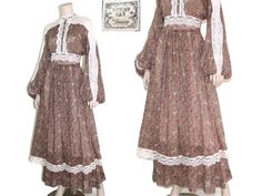 "This 70s-era Gunne Sax dress features a highly coveted novelty unicorn print, Victorian-style bodice with lace and pearl button accents, tie-back waist, voluminous balloon sleeves, and maxi length tiered skirt! Dress has a lined skirt and zips up the back. Best fits size xxs, xs, or small (please refer to measurements below). Accessories not included. Payment plans available. Approximate Flat Measurements: Multiply times 2 for bust, waist, and hip measurements. For best fit, compare with a simi Vintage Flowy Maxi Dress For Fall, Flowy Vintage Maxi Dress For Fall, Vintage Maxi Prairie Dress For Garden Party, Bohemian Prairie Dress With Ruffles In Maxi Length, Vintage Lace Maxi Dress For Garden Party, Flowy Lace Vintage Maxi Dress, Bohemian Prairie Dress With Ruffles, Vintage Flowy Maxi Dress For Festivals, Bohemian Maxi-length Prairie Dress For Garden Party