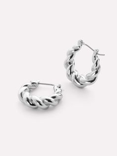 One of our most loved pieces, our twisted hoop Paris earrings, now for our silver babes. A little twisty, a little bendy, a lot of style—these rhodium-dipped hoop earrings are the perfect statement to wear everywhere, every day. Wear our silver twisted hoop earrings alone or pair them with other silver statement pieces like our Rox Mini Silver. • Rhodium-dipped huggie hoops • Features a unique textured look • 365-day warranty Daily Earrings, Twist Hoop Earrings, Silver Sisters, Twisted Hoop Earrings, Sleek Updo, Everyday Earrings, 925 Sterling Silver Earrings, Gold Hoop, Silver Hoops