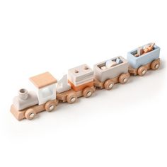 a wooden toy train is shown on a white background