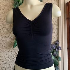 Small Black Sleeveless Top Helps Smooth Out Under Your Clothes Fitted Tops With Built-in Bra For Relaxation, Black Tank Top With Built-in Bra For Loungewear, Fitted Camisole With Built-in Bra For Relaxation, Bra Friendly Sleeveless Tank Top For Relaxation, Sleeveless Bra Friendly Tank Top For Relaxation, Black Camisole With Built-in Bra For Loungewear, Relaxation Tank Camisole, Stretch Tank Tops For Relaxation, Stretch Camisole Tops For Relaxation