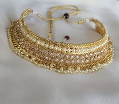 Check out this item in my Etsy shop https://www.etsy.com/listing/1256635982/gold-polki-choker-necklace-jhumka Adjustable Gold Kundan Necklace In Temple Jewelry Style, Adjustable Gold Kundan Necklace With Stone Work, Gold Kundan Necklace For Navratri Party, Adjustable Round Bridal Necklace For Festivities, Adjustable Gold Kundan Necklace Bollywood Style, Gold Jewelry With Stone Work For Navratri, Adjustable Gold Bollywood Bridal Necklace, Adjustable Bollywood Kundan Necklace, Bollywood Style Gold Bridal Necklace Adjustable