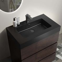 a bathroom sink sitting under a round mirror