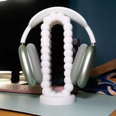 a pair of headphones sitting on top of a desk