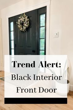 a black front door with the words trend alert black interior front door on it's side