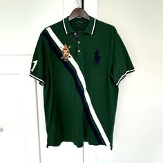 Polo Ralph Lauren Classic Fit Green White Navy Stripe Short Sleeve Shirt New With The Tag Size: Xl Material: 100% Cotton Care: Machine Wash/Dry Clean Classic Fit Pullover Point Collar 3 Button Neckline Short Sleeves Right Sleeve With White Embroidered "1" Left Chest With Navy Embroidered Pony Right Chest With Embroidered Crown Polo Straight Hemline With Side Vents New With The Tag, Never Worn! Approx. Measurements: Across The Underarms: 24" Sleeve Length From Shoulder Seam: 9.75" Length Down The Embroidered Crown, Striped Short Sleeve Shirt, Lauren Green, Ralph Lauren Shirt, Navy Stripes, Striped Shorts, Short Sleeve Shirt, Polo Ralph, Sleeve Shirt