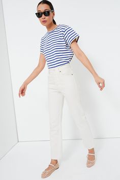 Perfect for casual-wear with an elevated feel, the Blue Stripe Devon Tee is sure to move to the top of your t-shirt pile. Thanks to small details that go a long way like the medium-weight cotton knit fabric, a banded neckline, and a slightly cropped rounded hemline, this silhouette is a necessity in any closet. Style it with white jeans and sneakers, with denim shorts and sandals, with a sweater thrown over your shoulders; it's sure to look cute no matter what! Crewneck Banded neckline Slightly Designed Shoes, Soft Feminine, Plus And Minus, Loeffler Randall, Small Details, Crystal Embellishment, Ballet Flat, White Blouse, Cotton Knit