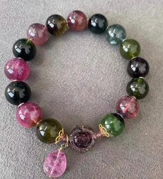 Material:  tourmaline beads  size :  Approx 11mm quantity: one strands 6mm approx 29 pcs one strands 7mm approx25 pcs one strands 8mm approx 22 pcs one strands 9mm approx 21pcs one strands 10mm approx 19 pcs one strands 11mm approx 18pcs one strands 12mm approx 16 pcs one strands 13mm approx 16 pcs one strands 14mm approx 15 pcs one strands 15mm approx 14pcs one strands 16mm approx 14 pcs one strands 17mm approx 13pcs one strands 18mm approx 13pcs one strands 19mm approx 12pcs one strands 20mm a Tourmaline Beaded Bracelets With Natural Stones, Tourmaline Gemstone Beaded Bracelets With Round Beads, Tourmaline Gemstone Beads Bracelet, Spiritual Tourmaline Beaded Bracelets With Round Beads, Tourmaline Bracelets With Round Beads As A Gift, Healing Tourmaline Gemstone Beads Bracelet, Spiritual Tourmaline Beaded Bracelet With Round Beads, Tourmaline Bracelet, Gift For Woman