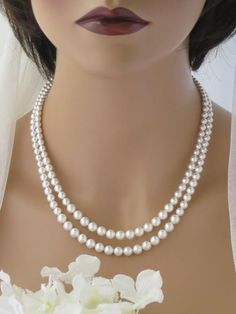 This simple and elegant Swarovski pearl necklace features 2 graduated strands with pearl sizes from 4mm to 7mm. The perfect finishing touch to your classic or vintage wedding! Double Strand Pearl Necklace For Formal Occasions, Formal Double Strand Pearl Necklace With Pendant, Formal Double Strand Pearl Necklace, Classic Double Strand Pearl Pendant Necklace, Classic Double Strand Pearl Necklace With Pendant, Classic Double Strand Pearl White Necklace, Elegant Double Strand Pearl Necklace With Charm, Elegant Double Strand Silver Pearl Necklace, Elegant Silver Double Strand Pearl Necklace