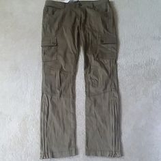 Dark Olive Green Pants With Cargo Pockets In Front With Flap And Button And 2 Top Pockets There Are Also 2 Slit Pockets In Back The Pants Have A 27" Inseam, 8" Rise. 16" Across Waist 18" Across Hip. The Are Also Belt Loops There Are 11" Zippers @ Bottom Of Pants. Size 6. Nwt Cargo Pants Color, Olive Green Pants, Dark Olive Green, Green Pants, Cargo Pants, Olive Green, Pant Jumpsuit, Pants For Women, Size 6