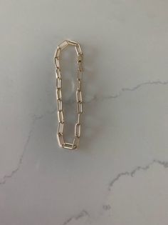 14K Gold Paperclip Bracelet, Square Shape Solid Gold, Gift For Her, 7" long 10x4 MM, Real Gold Bracelet, Lightweight, Women, Solid GoldGreat bracelet for everyday wear. It is lightweight and 14K solid gold♦ Materials: 14K Solid Gold ♦ Available color: Gold♦ Measurements: 7" long, 10x4MM Links, Oval Rectangular ShapeMATERIALSAll chains and pendants are made 14K Gold HOW TO FIND YOUR PERFECT FITTo measure, wrap a soft tape measure around your wrist, keeping the tape measure parallel to the floor a Real Gold Bracelet, Paperclip Bracelet, Gold Gift, Tape Measure, Square Shape, Paper Clip, Gold Material, Real Gold, Link Chain