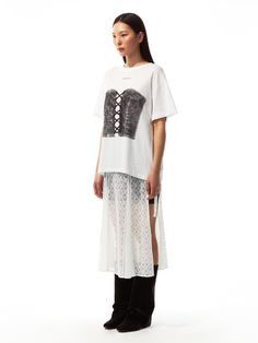 This product skillfully juxtaposes the relaxed fit of a casual T-shirt with the structured design of a printed corset, offering a comfortable yet bold fashion statement. The corset print adds an element of surprise and edginess, contrasting with the T-shirt's simplicity. - The oversized T-shirt serves as a soft canvas for the intricate corset print, making it a standout piece.- Easy to pair with a variety of bottoms, this top effortlessly transitions from day to night wear.- Breathable fabric ensures all-day comfort, while the corset illustration introduces a touch of rebellious style.- Its loose fit provides a modern silhouette, perfect for those who want to make a statement without compromising on comfort. Graphic Print Short Sleeve Tops For Daywear, Graphic Print Relaxed Fit Tops For Daywear, Graphic Print Tops For Summer Daywear, Corset Illustration, Printed Corset, Element Of Surprise, Structured Design, Night Wear, Casual T Shirt