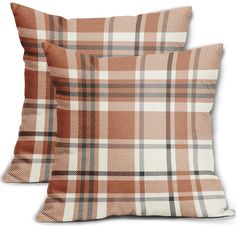 two brown plaid pillows sitting on top of each other