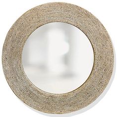 a round mirror that is made out of paper and has a rope around the edge