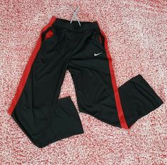 Nike Dri Fit Youth XL (Women's S) Black Red Track Pants Drawstring Mesh Workout. Condition is Pre-owned. Shipped with USPS First Class Package. Nice soft and comfy track pants.   Youth XL or could fit as a women's small, maybe medium.  Measures approximately 13 inches across the waist and 31 inches long.   Small imperfection on right knee but otherwise nice condition.   This is a pre-owned item, and though I looked it over when taking pictures and listing it, it is not a brand new item, and it i Nike Red Casual Sweatpants, Casual Red Nike Sweatpants, Red Nike Sweatpants For Sports, Red Nike Sports Pants, Nike Red Sweatpants For Sports, Nike Red Sports Pants, Red Sportswear Joggers For Gym, Sporty Red Joggers For Gym, Red Sporty Sweatpants For The Gym