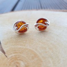 Welcome to handmade Baltic Amber jewelry shop. This Item is made of genuine, natural Amber. This item will make You look simple but gorgeous. Big round stud in amber earrings. Each is very nice, not so small and elegant. Stud in gemstone earrings. Small round studs. Sterling silver 925. Weight: ~ 1.3 gr Length: ~ 0.9 - 1 cm Our handmade jewelry is made with passion and love. If you have any problems with your order please contact us. Please note that colors can vary from originals depending on c Big Round Earrings, Baltic Region, Baltic Amber Jewelry, Amber Earrings, Natural Amber, Star Jewelry, Amber Jewelry, Baltic Amber, Brown Orange