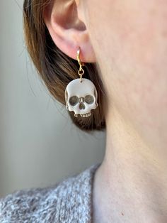 These Skull Earrings are spooktacularly stylish! They add the perfect amount of edge to any outfit. These sinister yet beautiful earrings will keep your style on-point! Earrings are made with lightweight polymer clay and plated brass. Note: Items are handmade and each is unique; patterns may vary slightly. Polymer Clay Jewelry Halloween, Earrings With Clay, Jewelry Halloween, Polymer Jewelry, Clay Jewelry Diy, Skull Earrings, Halloween Earrings, Polymer Clay Creations, Halloween Jewelry